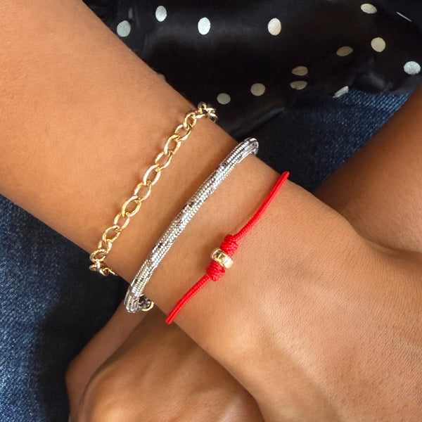 red cord bracelet