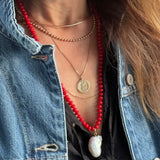 Long Coral Beaded Necklace by Becket & Quill, handmade in Los Angeles - worn close-up