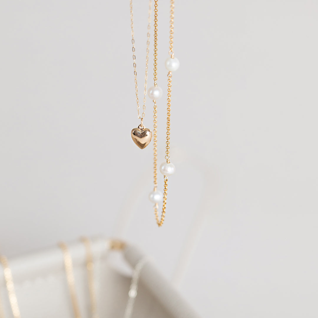 Petite Puffy Heart Necklace by Becket & Quill, handmade in Los Angeles - worn close-up