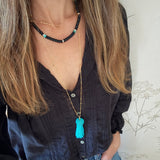 Turquoise tassel charm