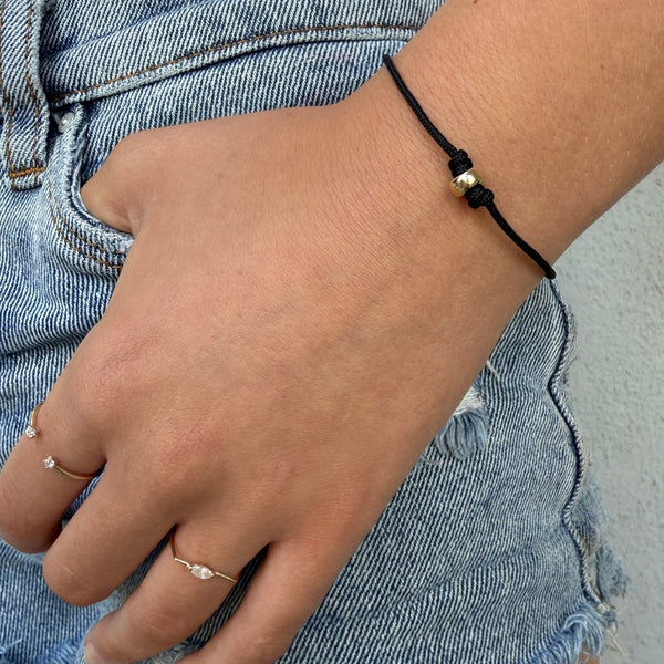 black cord bracelet