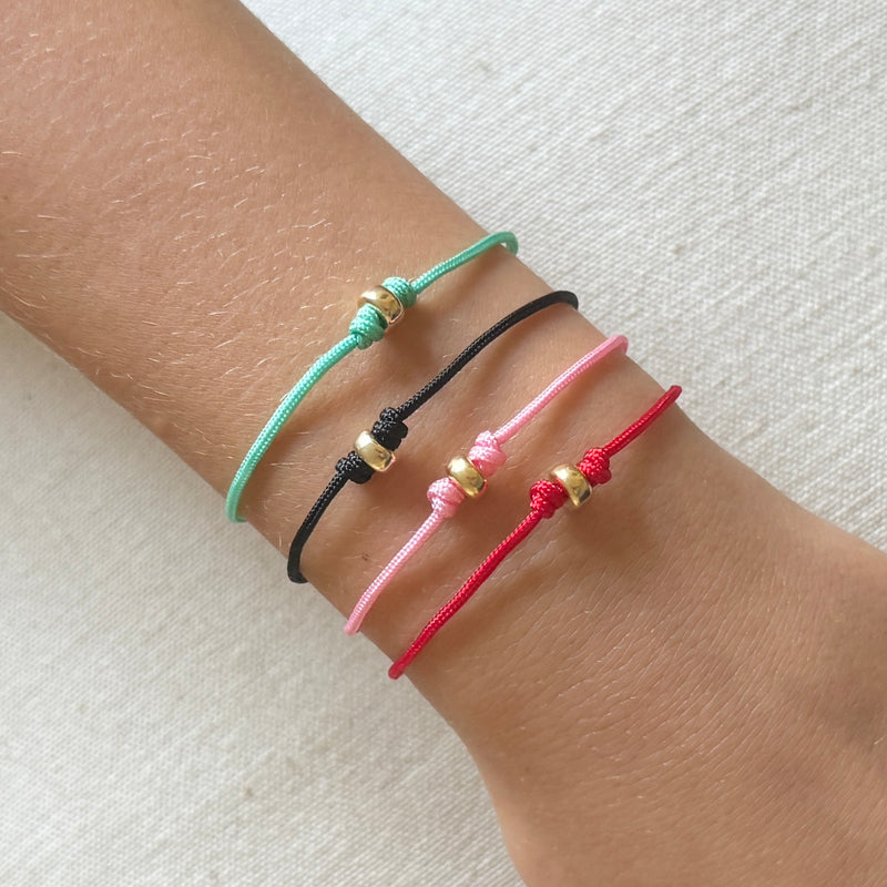 red cord bracelet