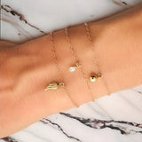 Angel Wing Charm Bracelet by Becket & Quill, handmade in Los Angeles - detail view