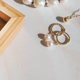 Pearl Huggies by Becket & Quill, handmade in Los Angeles - worn close-up