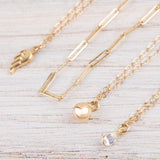 Angel Wing Charm Bracelet by Becket & Quill, handmade in Los Angeles - worn close-up