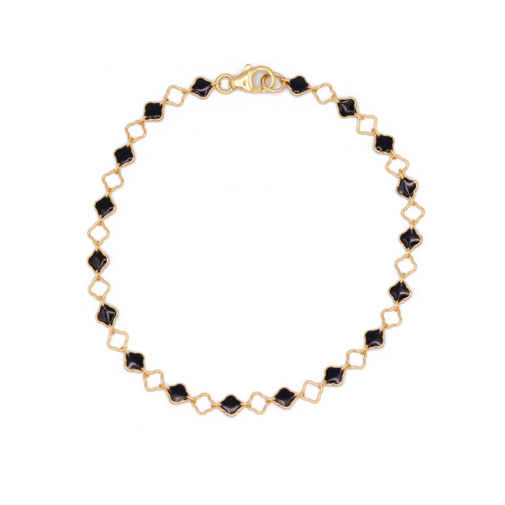 A gold filled chain bracelet featuring alternating black enamel clover shaped and small open clover  links, with a lobster clasp closure