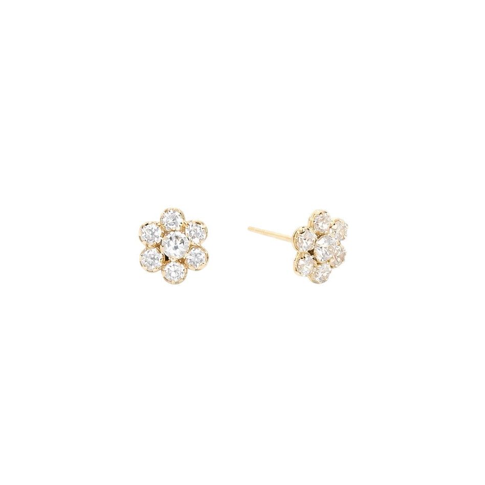 Pair of gold earrings with flower designed diamond-like stones 