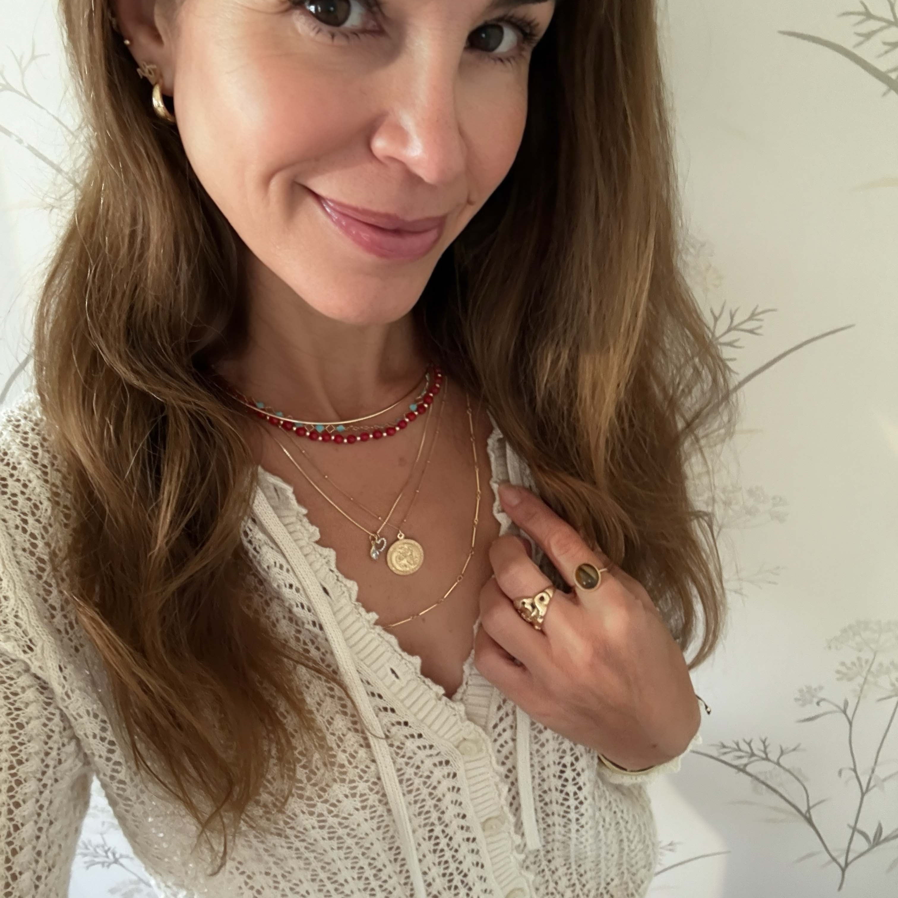 layered gold necklaces red coral beaded choker gold st christopherdisc pendant gold hoop earrings gemstone ring