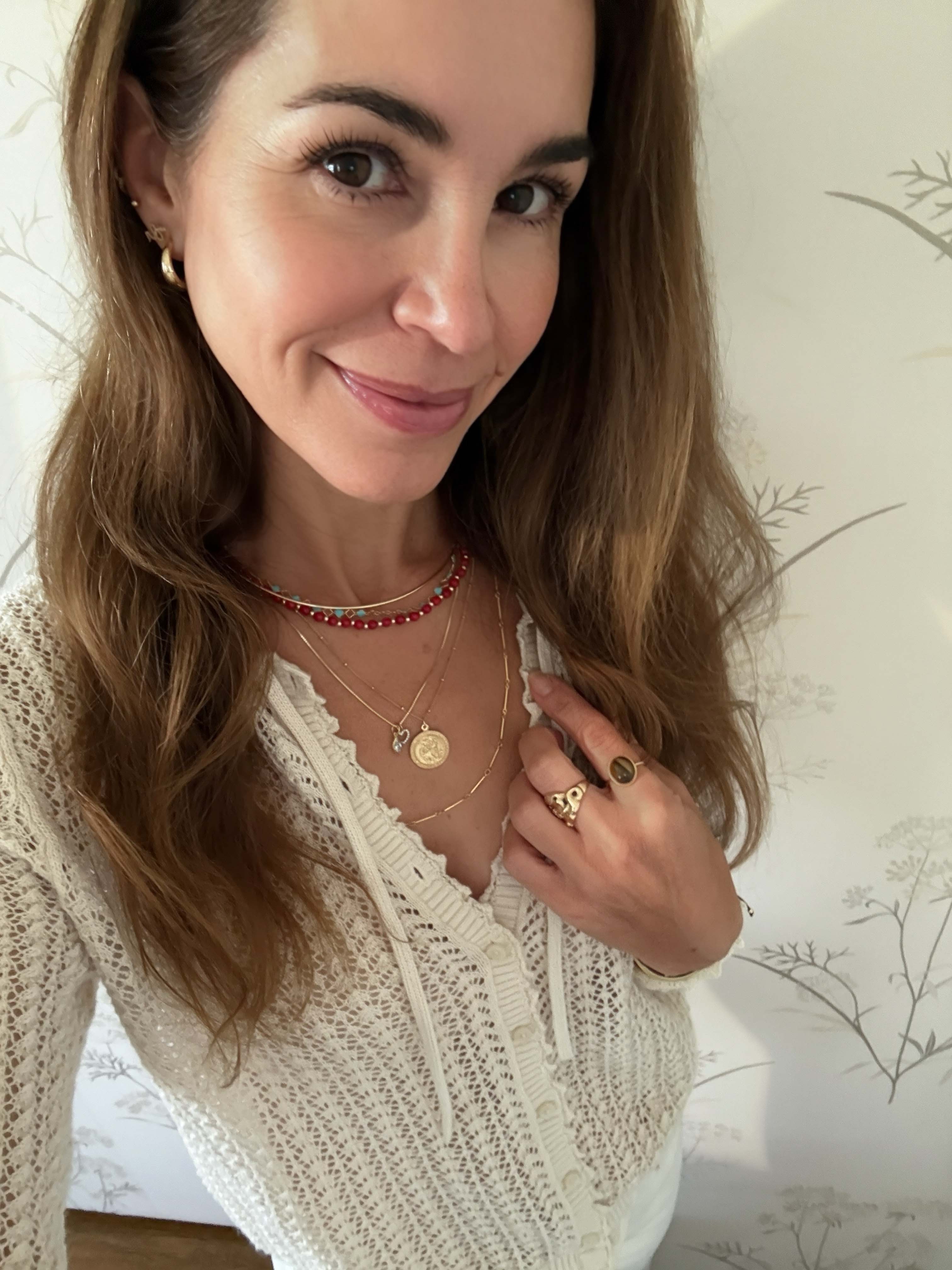 layered gold necklaces red coral beaded choker gold st christopherdisc pendant gold hoop earrings gemstone ring