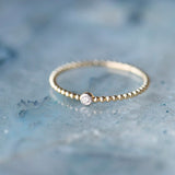 Petite Diamond Bead Band Ring by Becket & Quill, handmade in Los Angeles - worn close-up