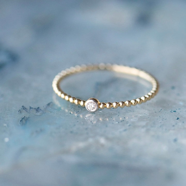 Petite Diamond Bead Band Ring by Becket & Quill, handmade in Los Angeles - worn close-up