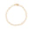 A delicate gold filled chain bracelet with repeating open quatrefoil clover links filled with white enamel inlay