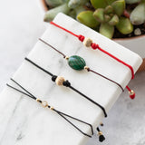 black and red macrame bracelets with CZ, gold and malachite beads 