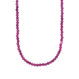 A beaded necklace made of faceted, round ruby beads