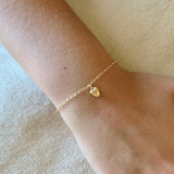 Small Heart Charm Bracelet by Becket & Quill, handmade in Los Angeles - worn close-up