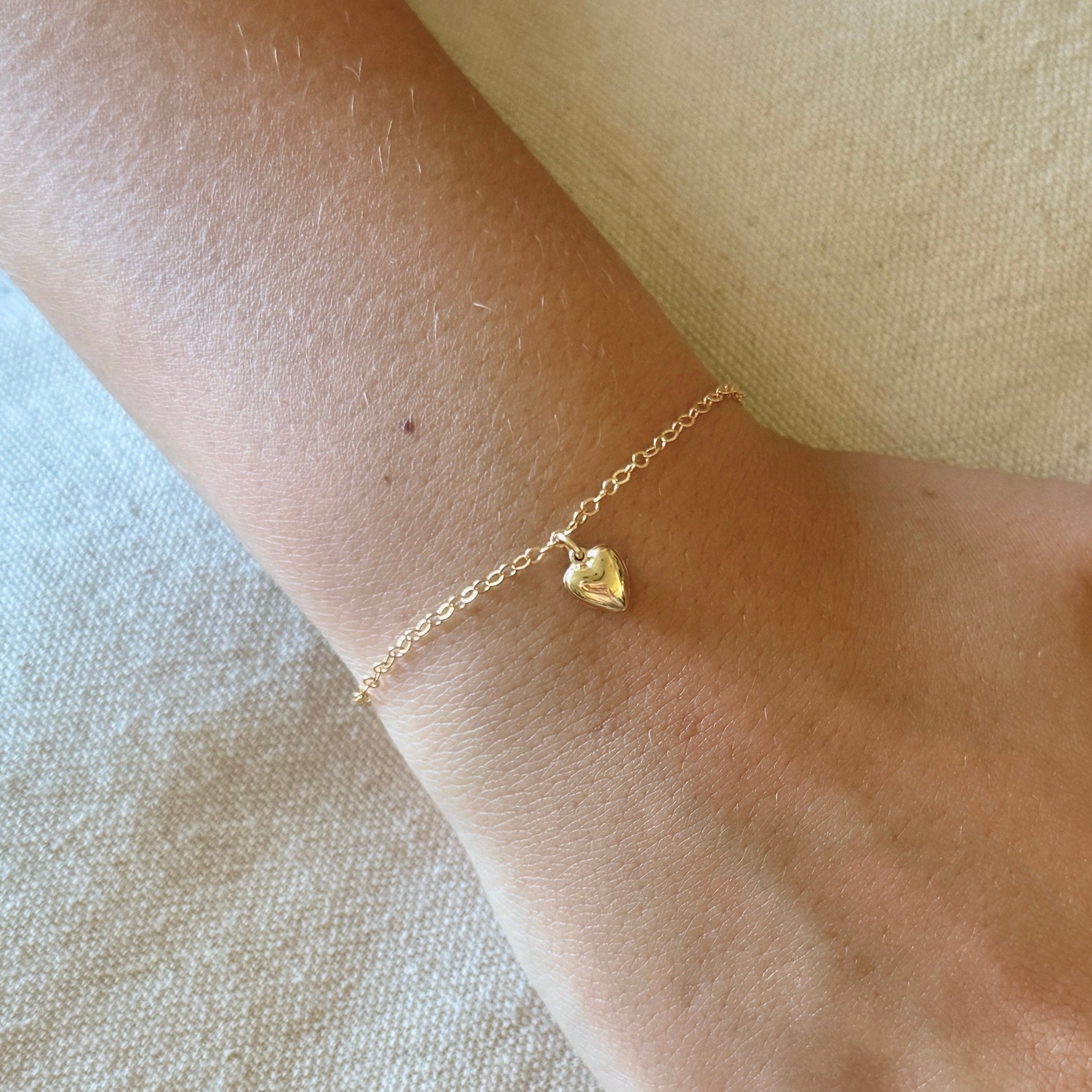 Small Heart Charm Bracelet by Becket & Quill, handmade in Los Angeles - worn close-up