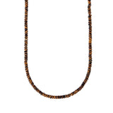A beaded necklace made of small, faceted brown and black tiger's eye beads
