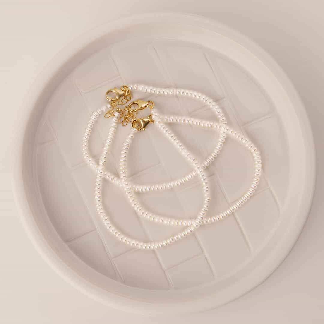 Button Pearl Bracelet by Becket & Quill, handmade in Los Angeles - worn close-up