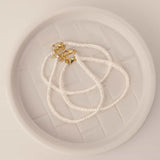 Button Pearl Bracelet by Becket & Quill, handmade in Los Angeles - worn close-up